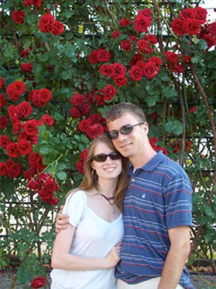 Jillian and Brian in front of roses